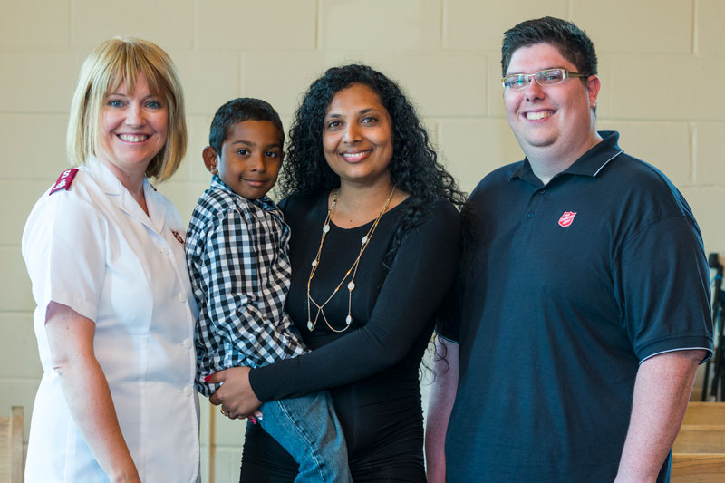 Amanda Carto and her son, Rohamall, receive support from Mjr Tina Mitchell and Kyron Newbury