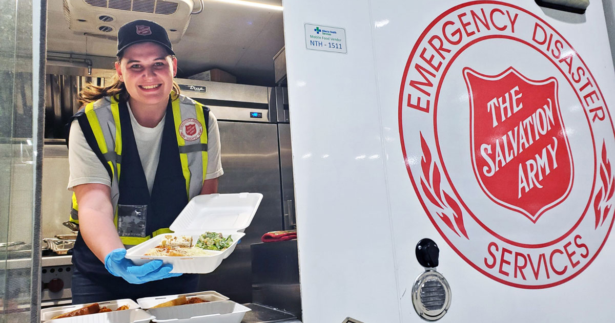 An EDS worker serves food on the front lines