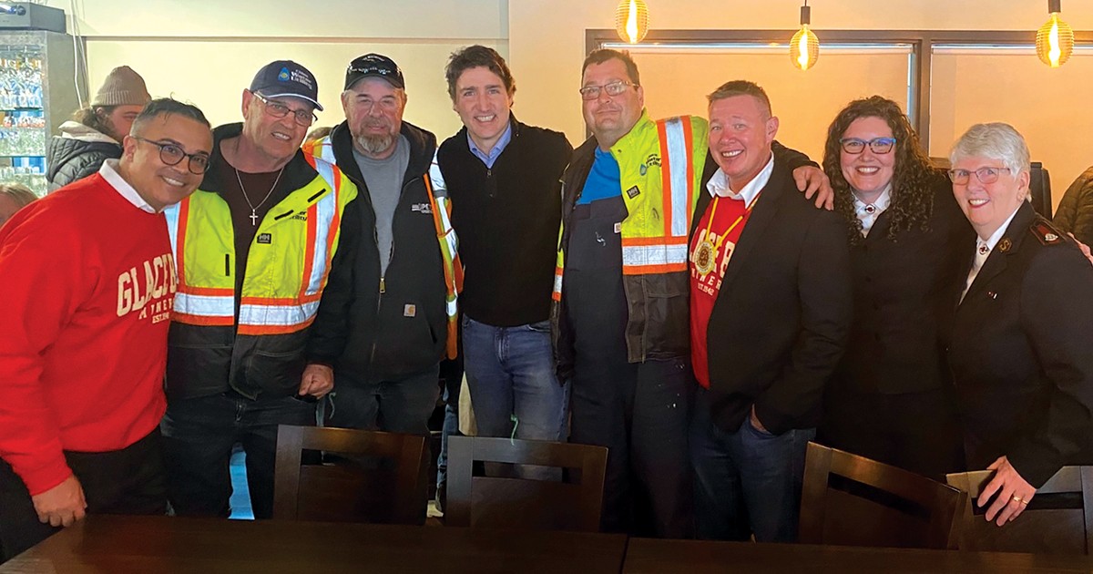 Prime Minister Justin Trudeau (middle) with Salvation Army personnel and volunteers at a thank-you reception in Glace Bay, N.S.